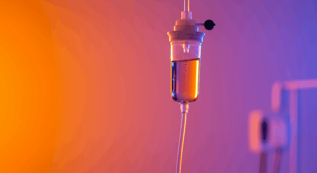 professional medical IV drip therapy treatment in a modern clinic setting, bright and clean environment, close-up of colorful vitamin infusion